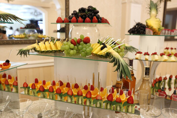The festive fruit table is beautifully decorated.
