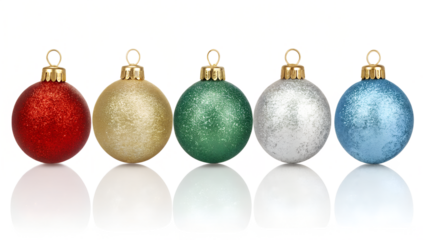 Sparkling Christmas ornaments arrayed, red, gold, green, silver, and blue hues shine.