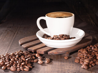 Coffee cup with froth surrounded by rich coffee beans for a cozy vibe