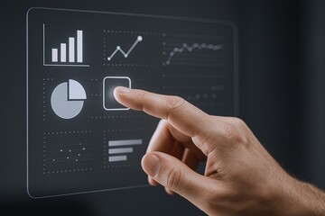 Close-up of a hand pointing at a digital analytics interface with graphs and pie charts.