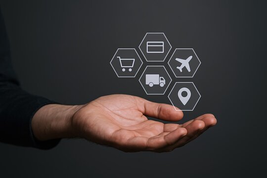 Hand holding digital icons representing shipping delivery logistics and transportation. - Powered by Adobe