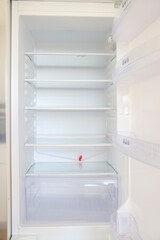 Empty Refrigerator with Open Door