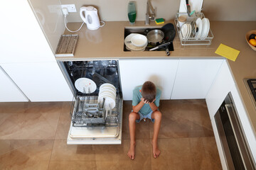 Tired Child with Dirty Dishes