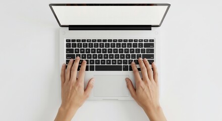 Overhead view of hands typing on a modern laptop with a blank white screen