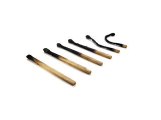 Burn and whole matches on white background	