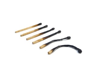Burn and whole matches on white background	