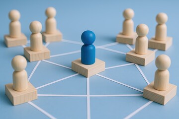 Fototapeta premium Wooden figurines connected by lines representing teamwork collaboration and networking.