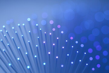 Abstract Fiber Optic Light Display with Blue Purple Bokeh Background for Technology Photography.