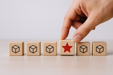 Hand selecting wooden blocks with cube icons and a red star on one block.
