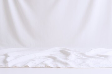 Obraz premium Cozy clean white bed with soft sheets and gentle folds in minimalist bedroom scene.
