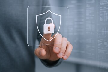 Modern digital security concept with user pressing transparent shield icon with lock.