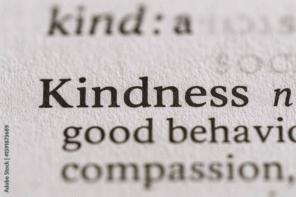 Poster close-up of the word kindness highlighted in black bold font on dictionary page showing its definiti