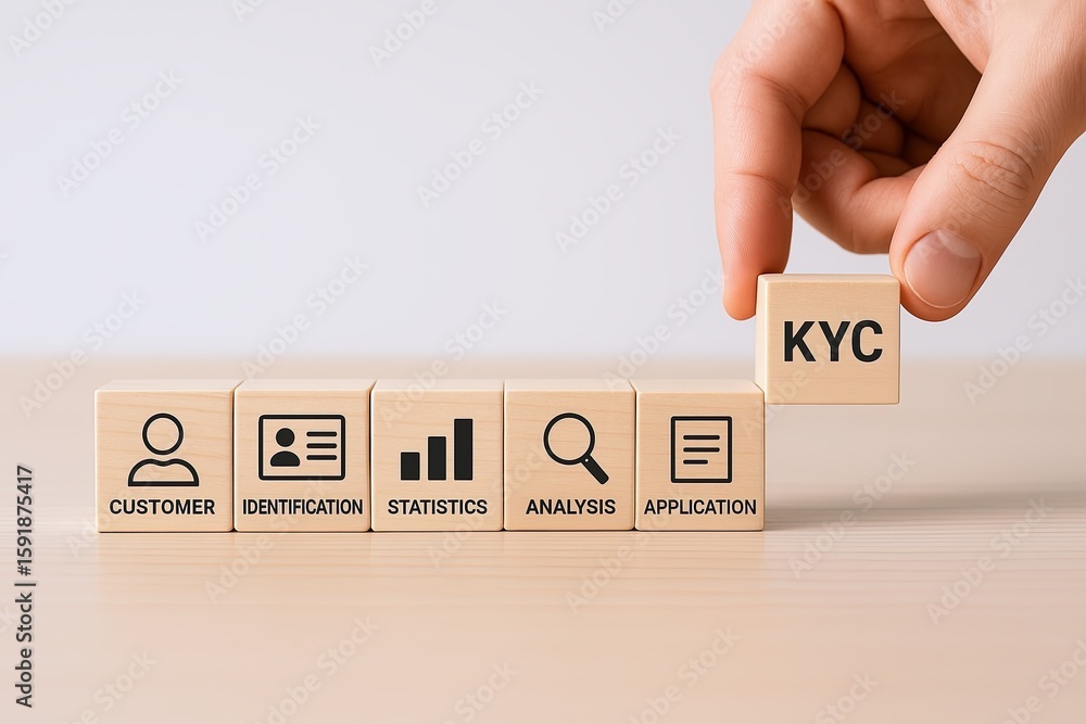 Poster hand holding block with kyc text on wooden blocks stack showing customer verification process.