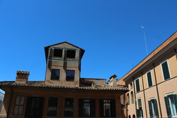 Cozy old street in Trastevere in Rome, Italy. Trastevere is rione of Rome, on the west bank of the Tiber in Rome, Lazio, Italy. Architecture and landmark of Rome Traditional ¨Rome buildings and houses