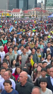 a large number of people were walking in a crowd
