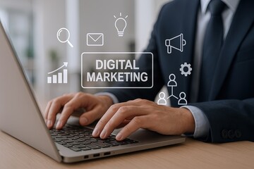 Professional businessman in formal suit using laptop with digital marketing icons overlay.