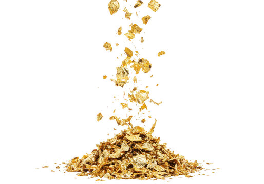 Golden flakes of metallic leaf are falling and accumulating into a shimmering pile on a transparent background