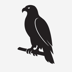 A majestic eagle or hawk captured in a bold black silhouette. This powerful vector art shows the bird of prey perched vigilantly on a branch, a symbol of strength and freedom