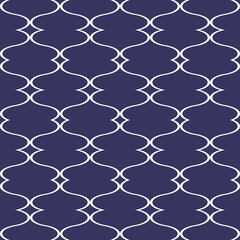 Seamless repeating pattern of white quatrefoil shapes on a dark blue background graphic design
