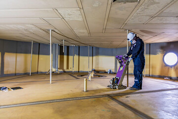 Male worker inspection floorscan tank wall, lose corrosion, soil side bottom plate tank inside...