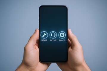 Close-up of a hand holding a smartphone with support service and quality icons on screen.