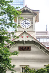 Sapporo Clock Tower Standing Tall Amidst Lush Greenery

