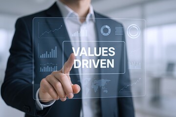 Businessman interacting with transparent digital interface displaying "Values Driven" concept.