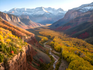 Majestic Canyon with Autumn Trees and Distant Snow Peaks