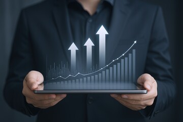 Businessman Holding Digital Tablet Showcasing Growing Graph with Upward Arrows.