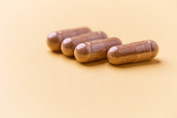Carnitine capsules. Concept for a healthy dietary supplementation. Bright paper background. Soft focus. Close up.	