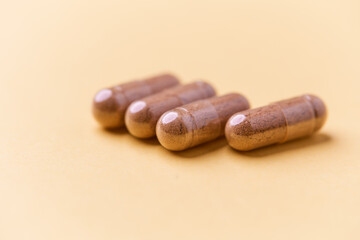 Carnitine capsules. Concept for a healthy dietary supplementation. Bright paper background. Soft focus. Close up.	