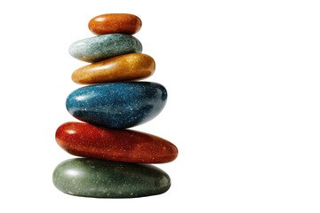 Colorful polished stones stacked in balance create a zen like calming peaceful still life arrangement art