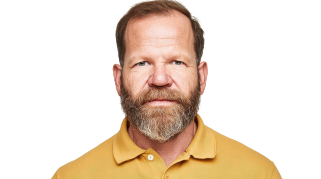 Portrait of a man with beard in yellow shirt looking at camera for headshot photography concept