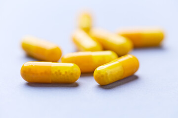 Vitamin C capsules. Bright background. Close up. Copy space.	