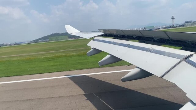 Smooth Airplane Landing at Seoul Gimpo Airport with Stunning Airport  View Through Window