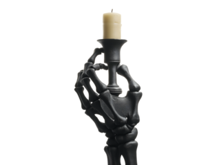Halloween concept. Black skull skeleton hand holding a candle isolated on a transparent background