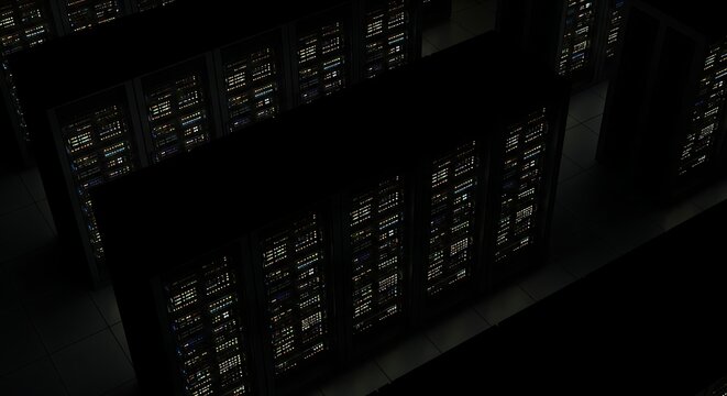 Nighttime aerial view of densely packed city buildings, illuminated windows showing signs of life within.