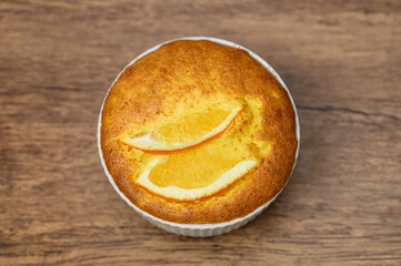 Orange cake with visible slices of ripe oranges, top view,