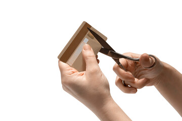 Hand cutting with scissors credit card. The concept of blocked bank accounts, bankruptcy,...