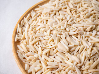 White Almond Stick set on wooden board and white background.