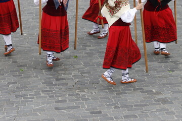 Young women dancing wearing the traditional basque dress