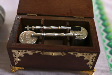 A box with church supplies for the baptism ceremony.