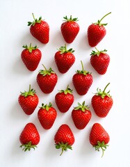 Fresh strawberries arranged in a grid pattern