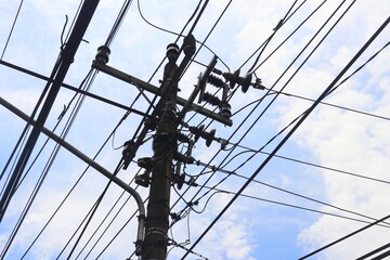Messy and unorganized electrical cables are commonly seen in urban areas. Overhead high-voltage...