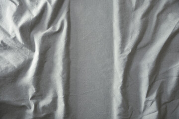 Gray fabric wrinkled and ironed vertically in the center