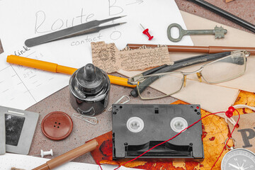 OSINT-themed creative workspace with vintage tools, handwritten notes, and press elements