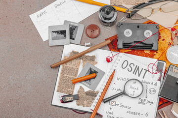 OSINT-themed creative workspace with vintage tools, handwritten notes, and press elements
