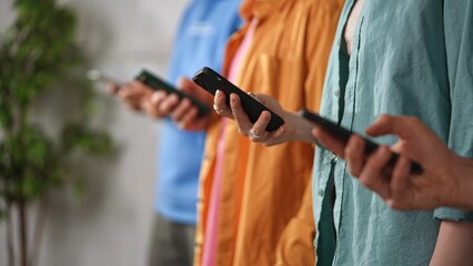 Group of People Engaging with Smartphones in Casual Setting