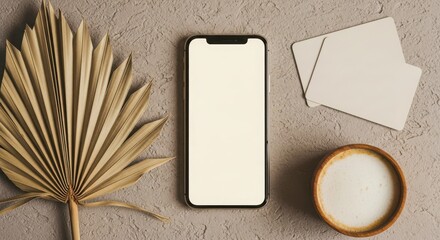 Modern flat lay featuring a smartphone dried palm leaf coffee and blank cards on textured background