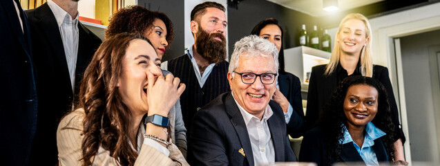 Multiracial business team sharing laughter and positivity during a casual office meeting. Real joy,...